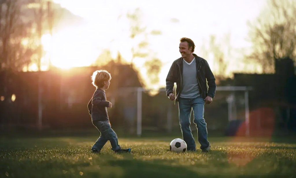 padre y su hijo jugando a fútbol padre e hijo jugando al fútbol